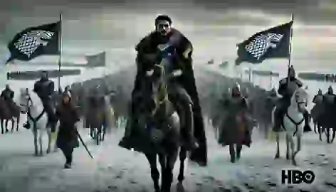 The Stark army led by Robb Stark marches south across a snowy landscape with banners flying high.