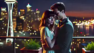 Christian and Anastasia reunite on a rooftop at night, the Seattle city lights glowing behind them, signifying hope and affection.